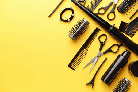 Set of hairdresser tools and accessories on color backgroundの写真素材