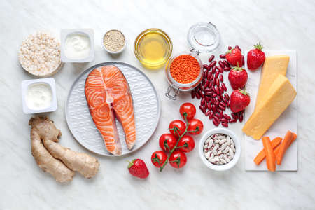 Different healthy food on light tableの写真素材