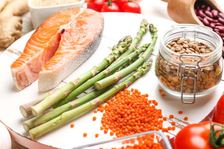 Different healthy food on wooden board