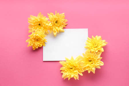 Beautiful composition with flowers and blank card on color background
