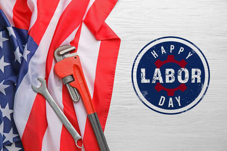 Tools and USA flag on white wooden background. Labor Day celebrationの写真素材