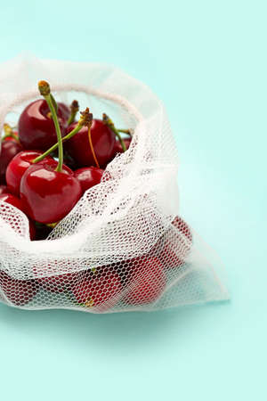 Eco bag with cherry on color backgroundの写真素材