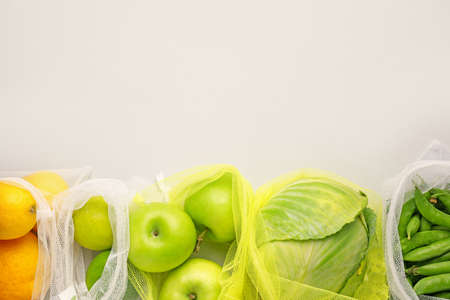 Eco bags with different products on light backgroundの写真素材