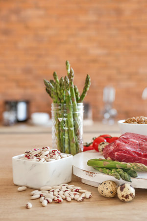 Different healthy food on table in kitchenの写真素材