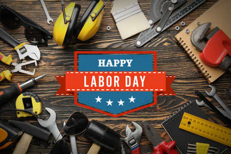 Set of tools on wooden background. Labor Day celebration