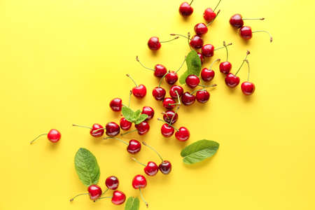 Sweet ripe cherry on color backgroundの写真素材