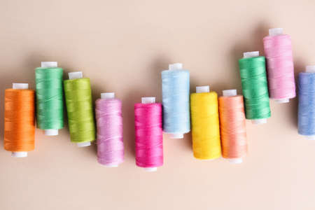 Many sewing threads on color backgroundの写真素材