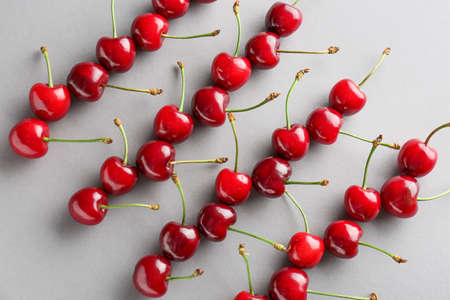 Sweet ripe cherry on gray backgroundの写真素材