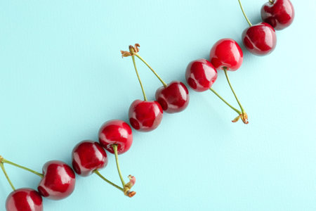 Sweet ripe cherry on color background