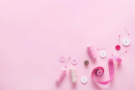 Set of sewing threads and accessories on color backgroundの写真素材