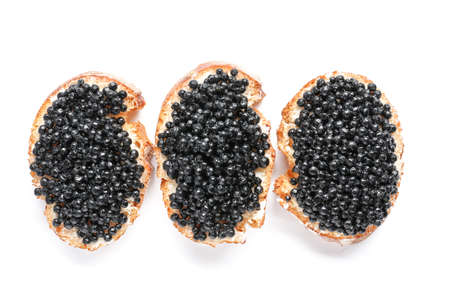 Sandwiches with black caviar on white backgroundの写真素材