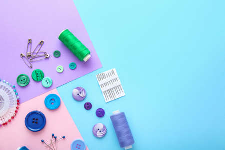 Set of sewing threads and accessories on color backgroundの写真素材