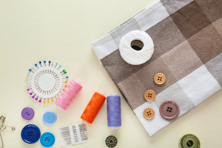 Set of sewing threads and accessories on light background