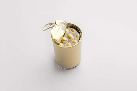Tin can with olives on gray background