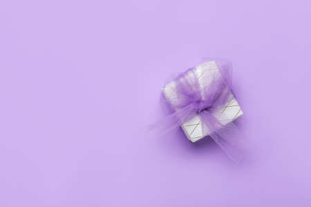 Beautiful gift box on color backgroundの写真素材