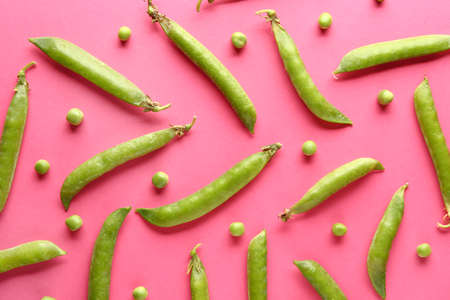 Tasty fresh peas on color backgroundの写真素材