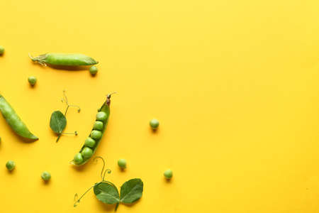 Tasty fresh peas on color backgroundの写真素材