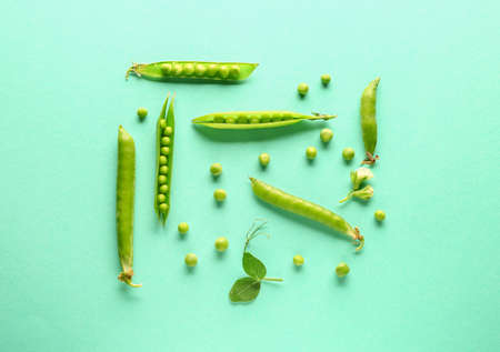 Tasty fresh peas on color backgroundの写真素材