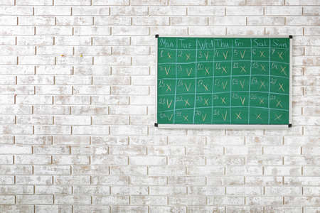 Blackboard with drawn calendar in office