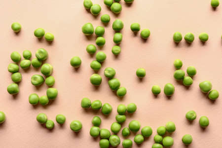 Tasty fresh peas on color backgroundの写真素材