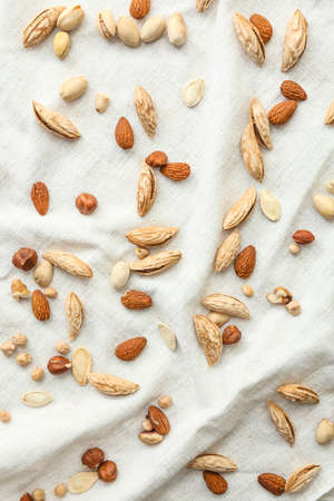 Many almonds on white cloth