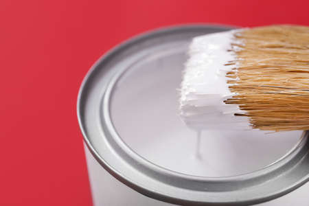 Can of paint and brush on color background, closeupの写真素材