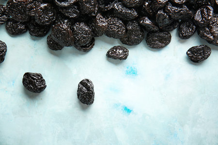 Tasty prunes on color backgroundの写真素材