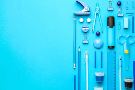 Set of school supplies on color background