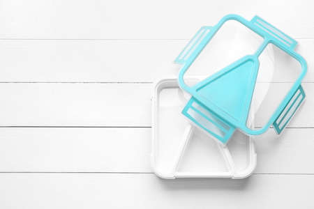 Plastic lunch box on white wooden backgroundの写真素材
