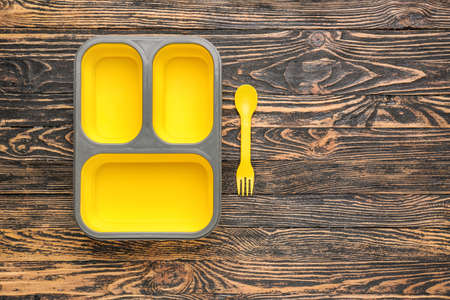 Plastic lunch box on wooden backgroundの写真素材
