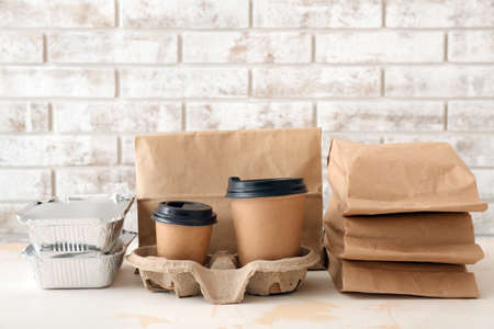 Assortment of food delivery containers on tableの写真素材