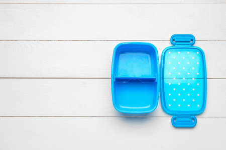 Plastic lunch box on white wooden backgroundの写真素材