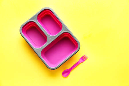 Plastic lunch box on color backgroundの写真素材