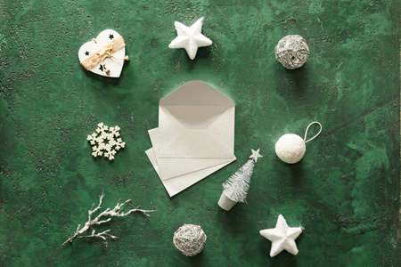 Christmas decor and envelopes on color backgroundの写真素材