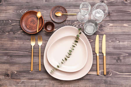 Beautiful table setting on wooden backgroundの写真素材