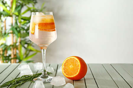 Glass of tasty summer cocktail on table