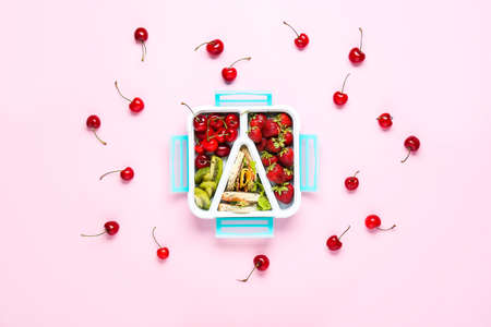 School lunch box with tasty food on color backgroundの写真素材