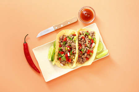 Plate with tasty fresh tacos on color backgroundの写真素材