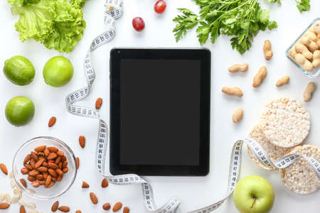 Tablet computer on workplace of nutritionistの写真素材