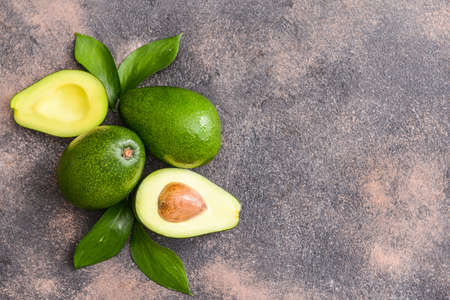 Fresh ripe avocados on gray backgroundの写真素材