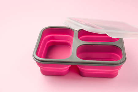 Empty school lunch box on color backgroundの写真素材