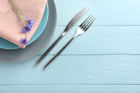 Beautiful table setting on wooden background