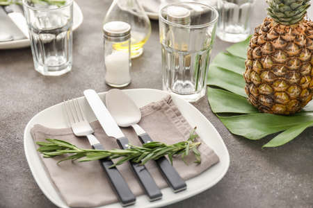 Beautiful table setting on gray background