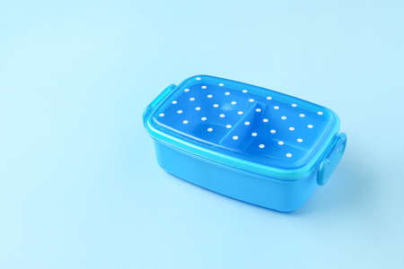Plastic lunch box on color background