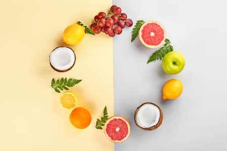 Frame made of different fruits on color backgroundの写真素材