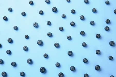 Many ripe blueberry on color backgroundの写真素材