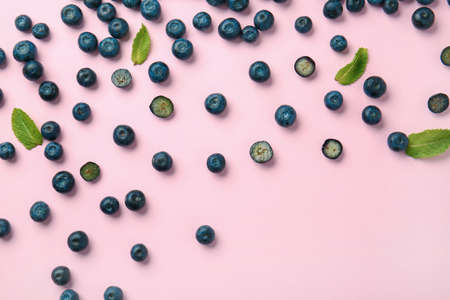 Many ripe blueberry on color backgroundの写真素材