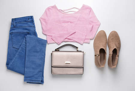 Stylish female look with jeans clothes on white backgroundの写真素材