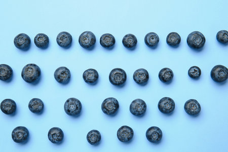 Many ripe blueberry on color backgroundの写真素材