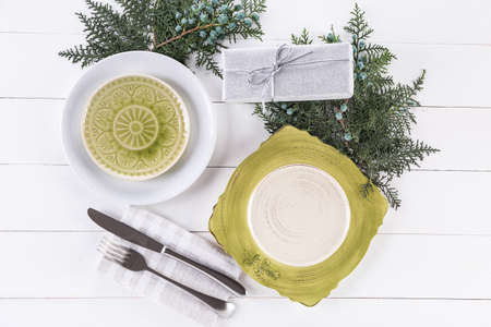 Beautiful table setting for Christmas on white wooden background
